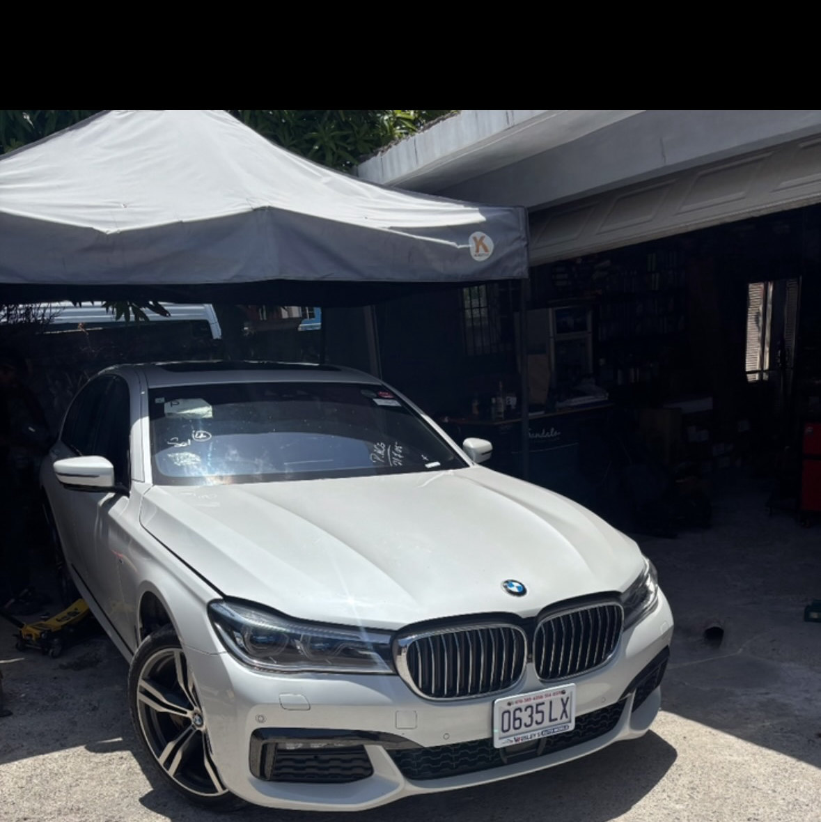 A BMW 740i in the JRC Automotive workshop bay
